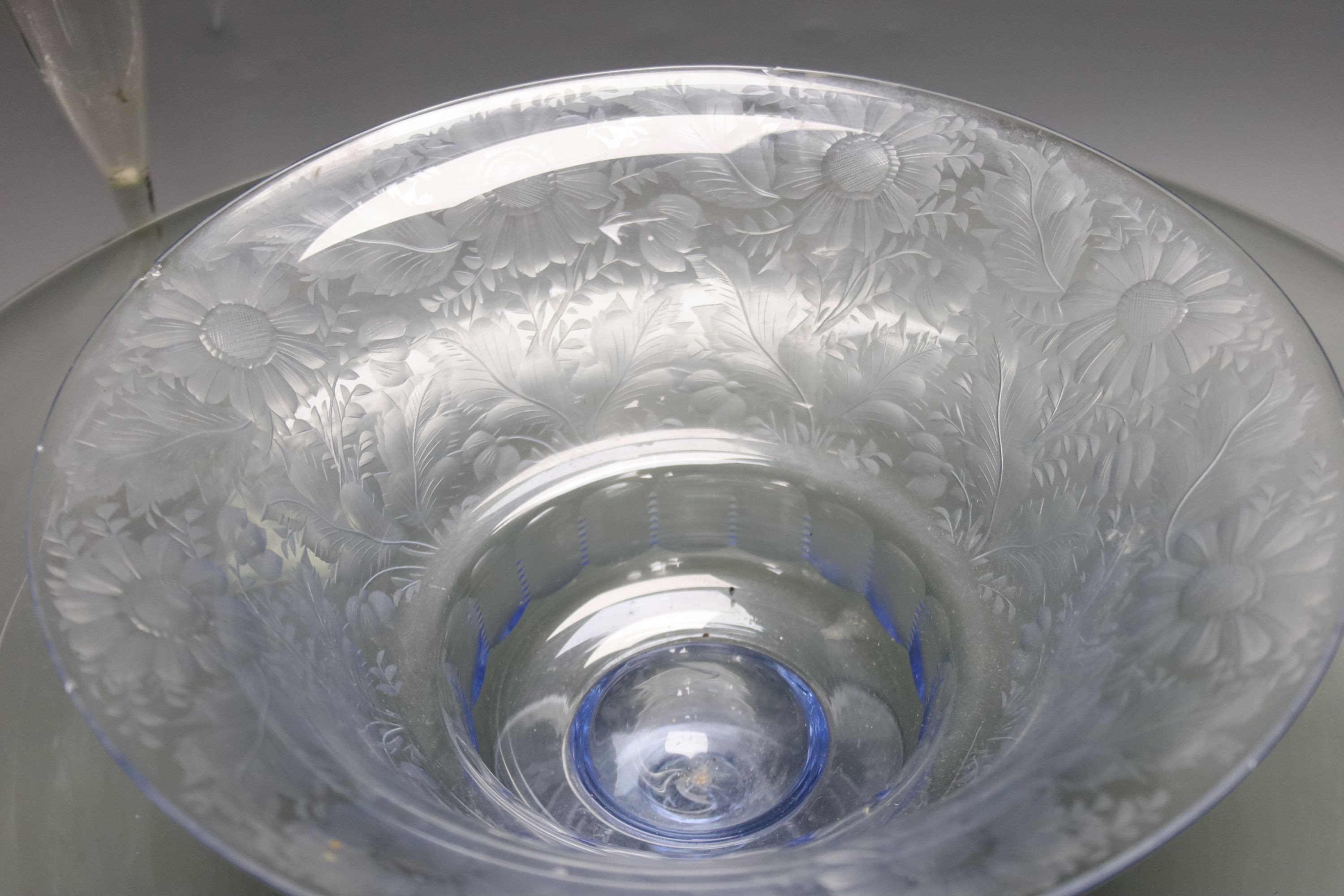 A Dutch Venetian style tall glass flute, the twisted stem with blue bead decoration, H 38cm, a 'Facon-de-Venise' style blue-tinted pedestal bowl, foliate-engraved and another glass dish (3)